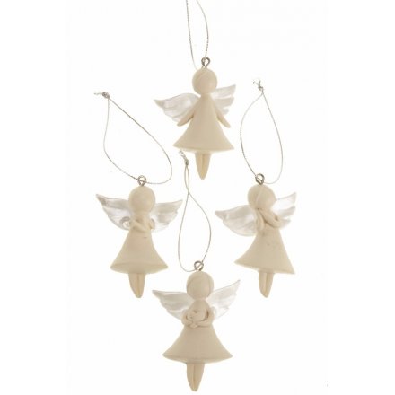 Set of four white angel decorations hanging against a white background