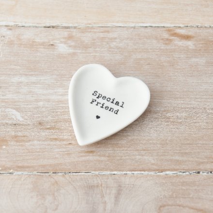Heart shaped white ceramic trinket dish with the quote 'special friend' printed on in a typewriter front. Underneath is a small heart.