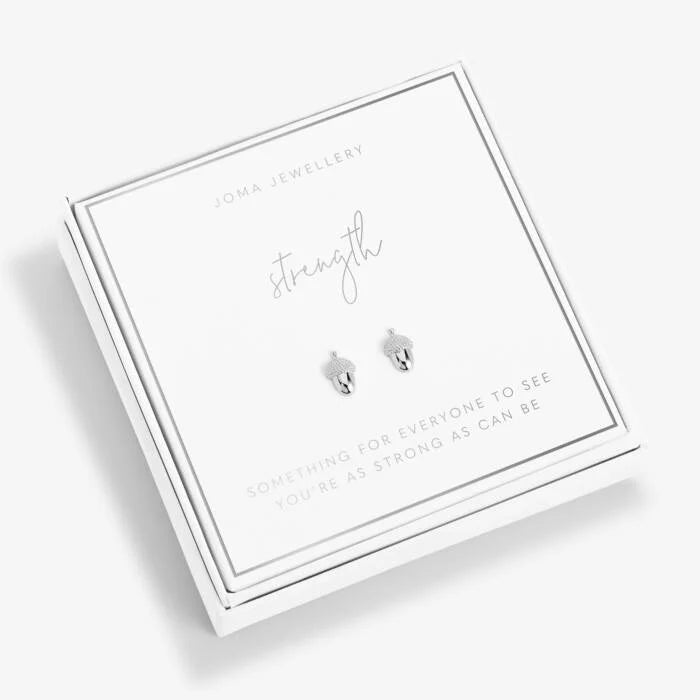 Silver acorn design earrings packaged in a square white box featuring the word 'strength' above and the text 'something for everyone to see you're as strong as can be. 