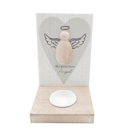 Wooden angel figurine with a heart-shaped card in the background
