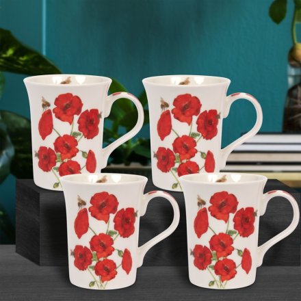 Four white mugs with a red poppy design on front and back and handle. Inside on the rim is a small pee design. 