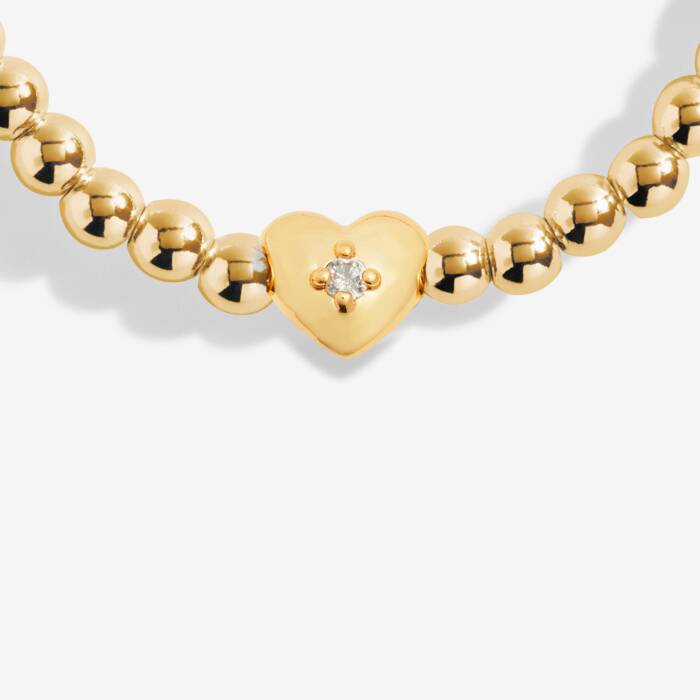Gold bracelet with cubic zirconia-crowned heart charm 