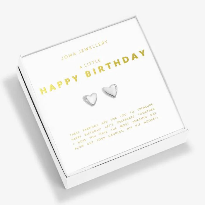 Heart shaped earrings featuring small crystals on the edge. Packaged in a square white box featuring the text 'A little happy birthday' above the earrings and 'these earrings are for you to treasure. Happy birthday! Let's celebrate together I hope you have the most amazing day, blow out your candles, hip hip hooray!' both in gold text.