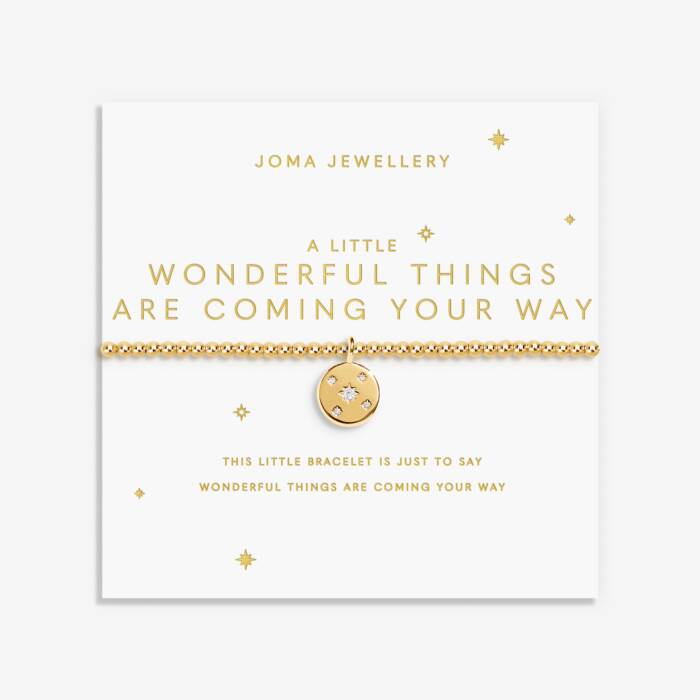 Gold bracelet with a pendant on a Joma Jewellery card with text