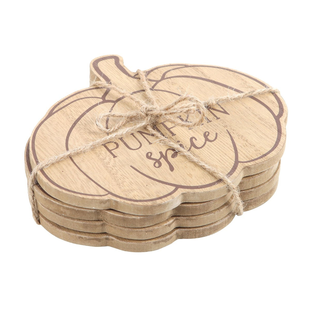 Set of wooden pumpkin-shaped coasters with 'Pumpkin Spice' text, tied with twine on a white background.
