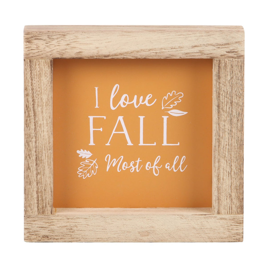 Wooden frame with 'I love Fall Most of all' text on an orange background