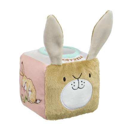 Plush toy activity cube with rabbit ears and face on a white background