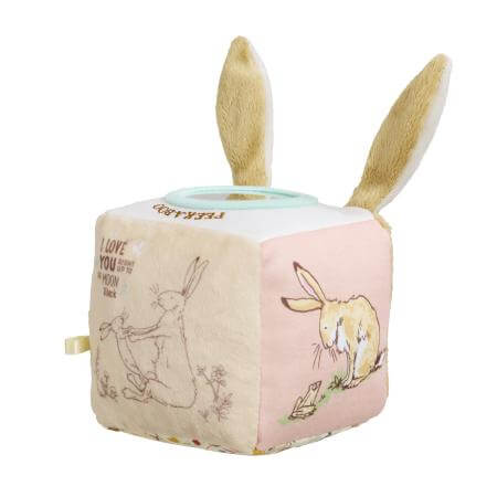 Children's plush toy activity cube with bunny ears and rabbit illustrations on a white background