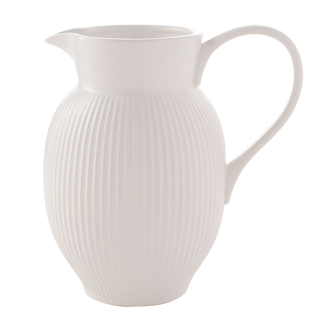 Ribbed white jug shaped vase with large handle