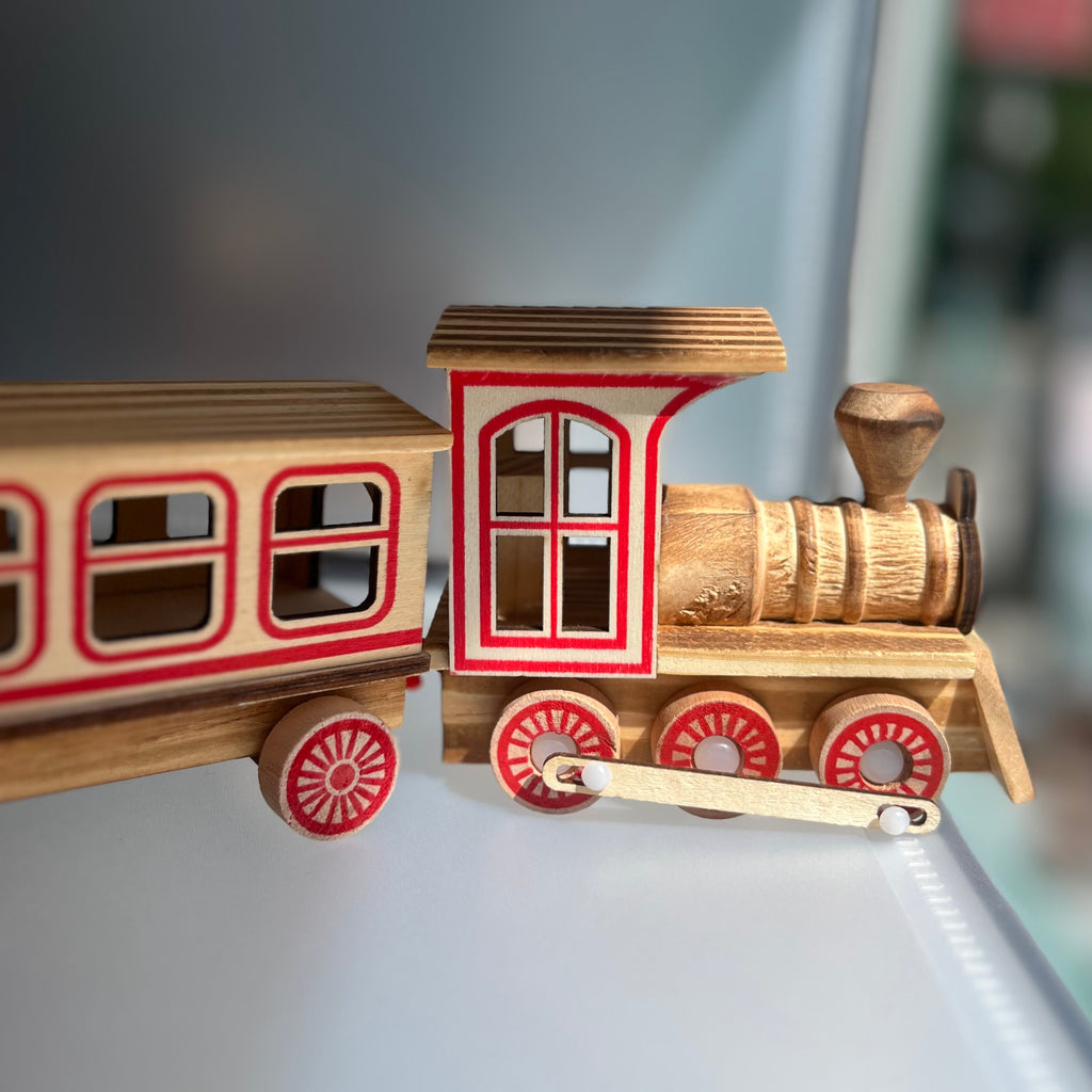 Wooden toy train with red accents 