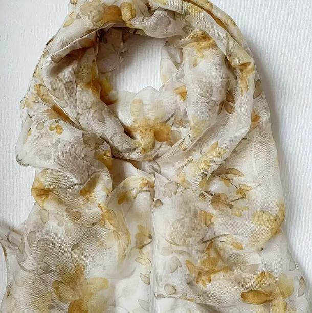 Muted yellow floral scarf with watercolour design flowers.