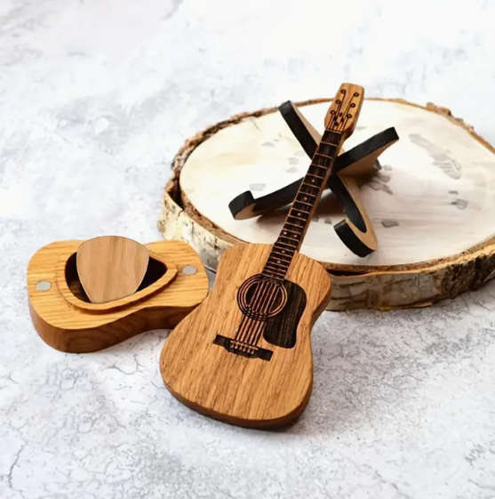 Mini wooden guitar shaped pick holder. Pick shaped hole in the back of the guitar for storage. Comes with stand to hold mini guitar in. 