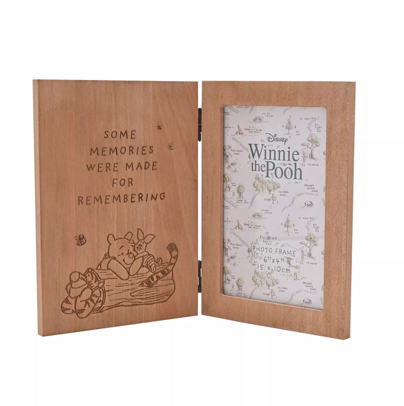Wooden photo frame with 'Winnie the Pooh' design and text on a white background