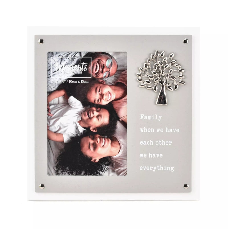 Decorative photo frame with family photo and tree design on a white background