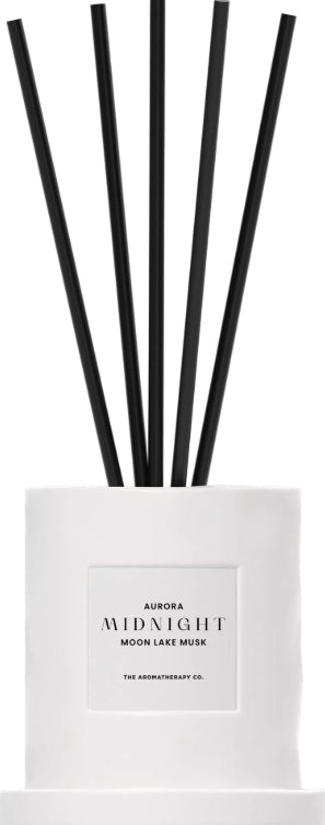 Aurora Midnight diffuser with black sticks on a white background