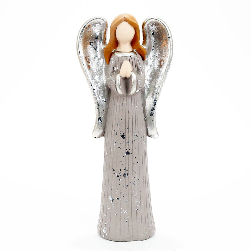 Angel figurine with silver wings and a gray dress on a white background
