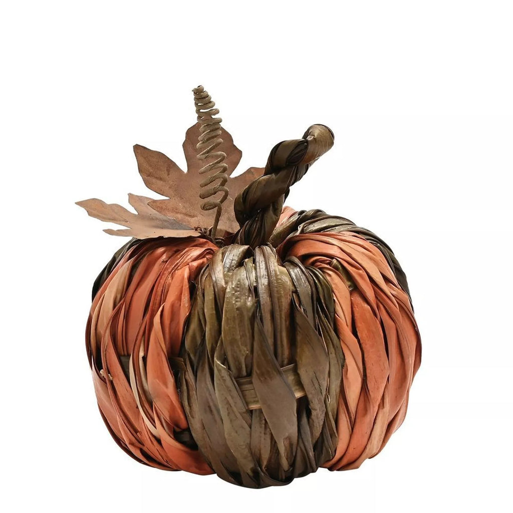 Decorative pumpkin made of woven materials on a white background