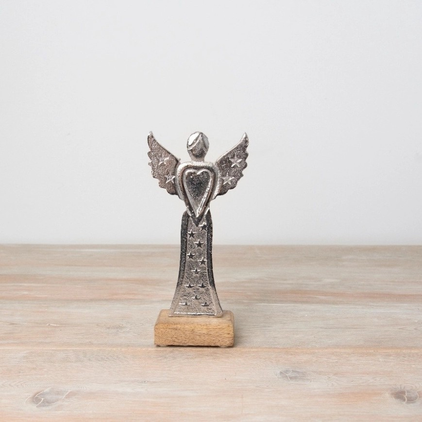 Silver angel on wooden base. Features star design on skirt and a heart shaped torso with stars on the wings. 