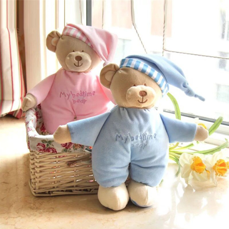 Two plush teddy bears wearing pajamas, one in pink and one in blue, sitting in a basket with a 'My Bedtime Bear' inscription.
